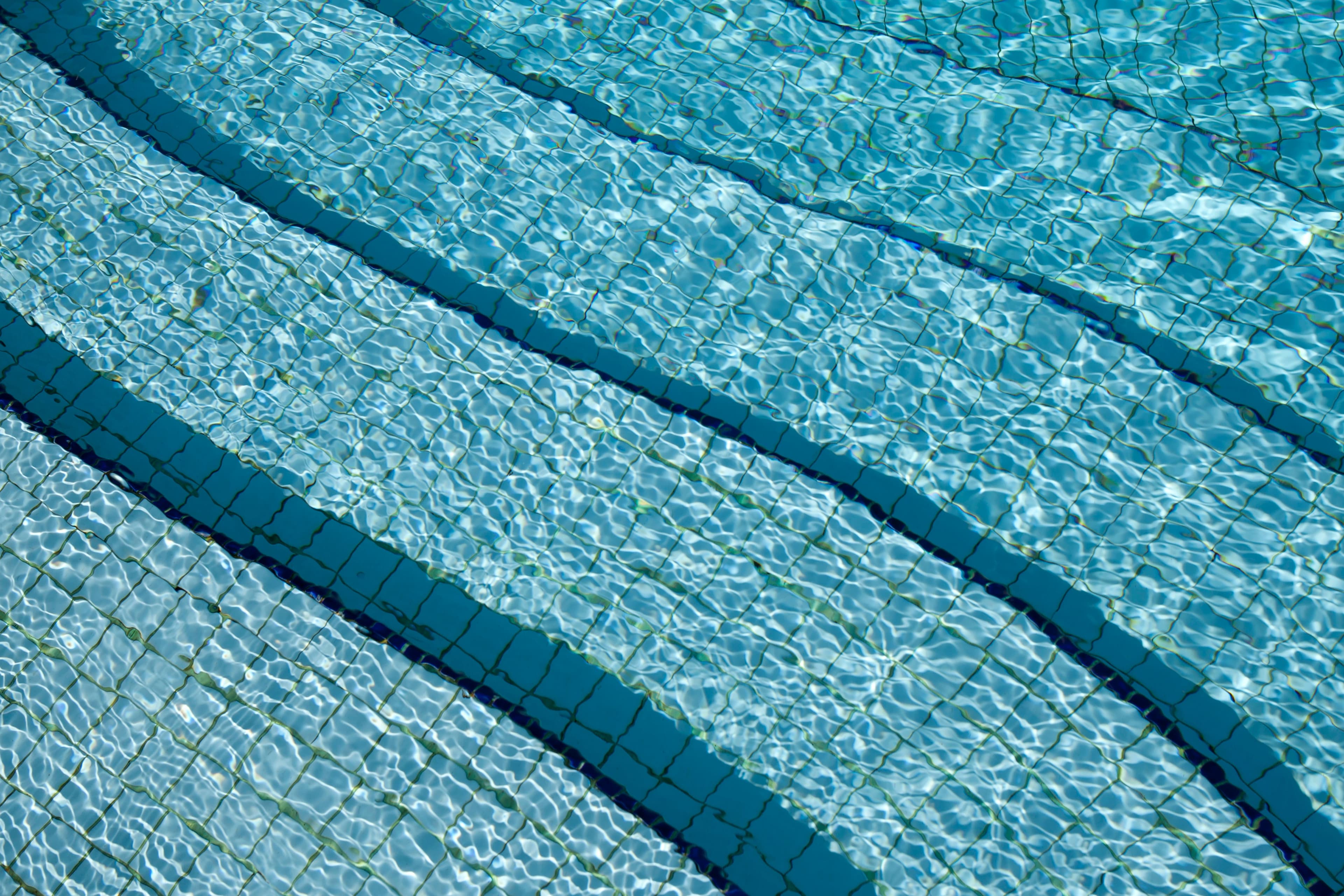 Crystal clear swimming pool water after a cleaning visit