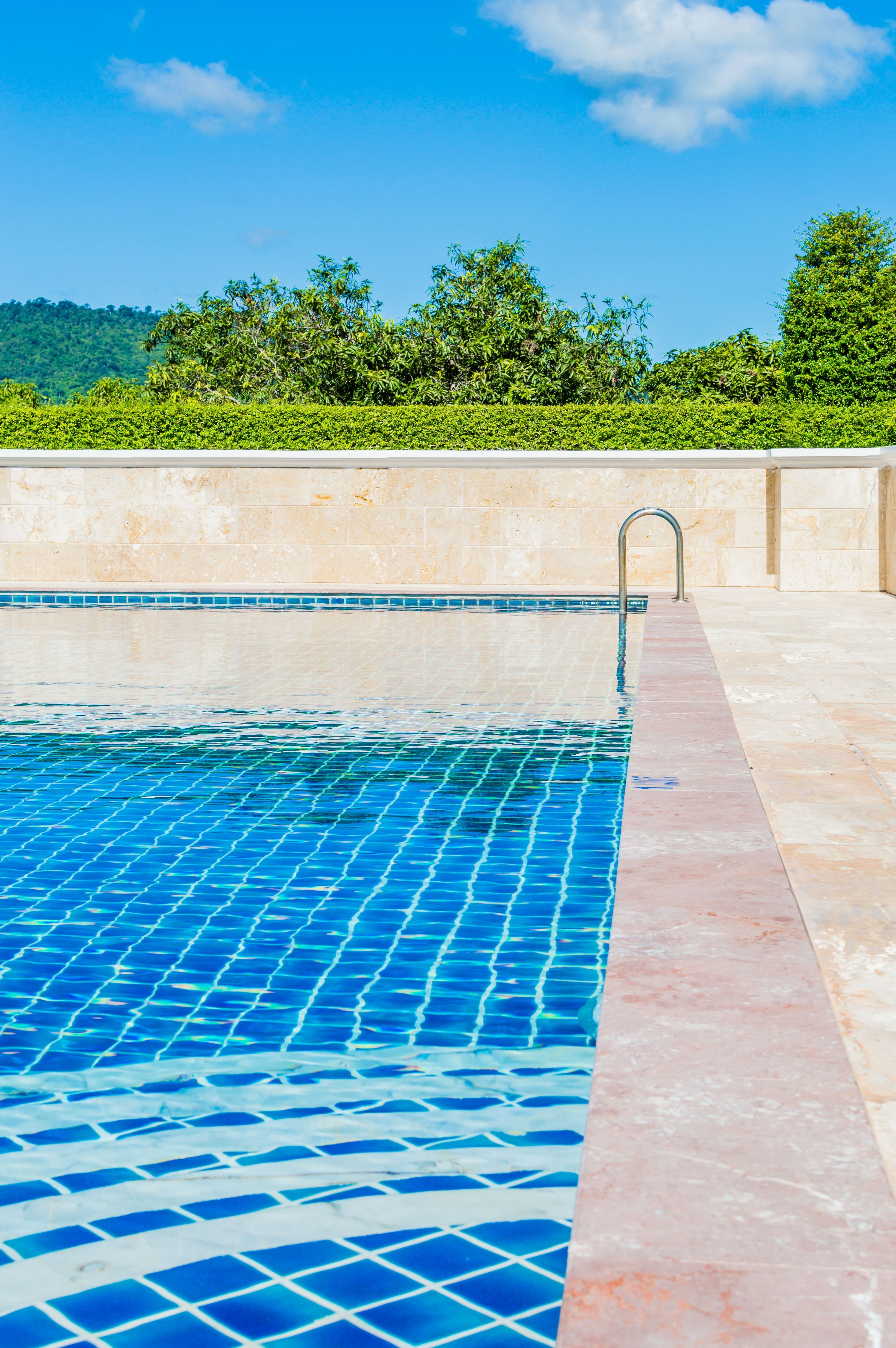 Well-maintained turquoise pool after equipment repair